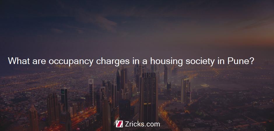 What are occupancy charges in a housing society in Pune?