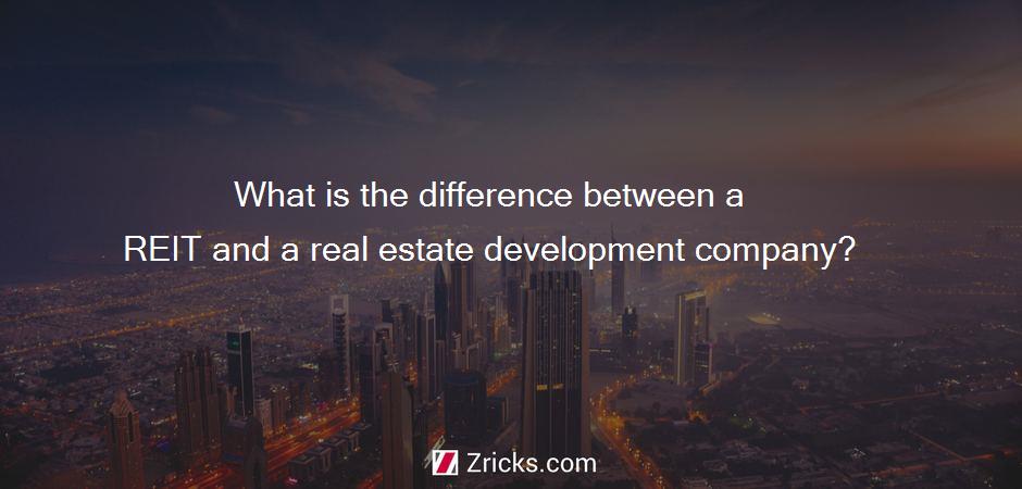 What is the difference between a REIT and a real estate development company?